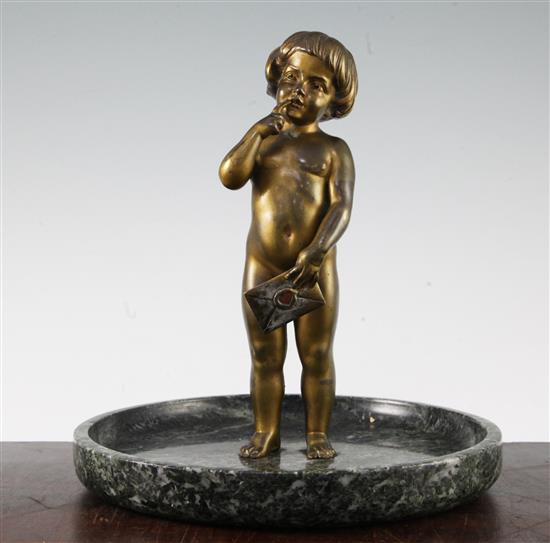 An early 20th century patinated bronze of a small child standing holding a letter, 9ins wide